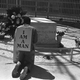 A striking Atlanta sanitation worker kneels at the grave of Dr. Martin Luther King Jr. after a rally by Southern Christian Leadership Conference supporting the strike in Atlanta on April 4, 1970. King was killed in Memphis, Tenn., two years earlier while supporting a sanitation workers’ strike there. The picket signs reading “I Am A Man” were first used in the Memphis strike.